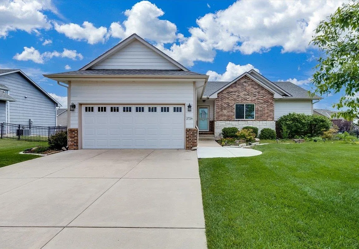 Custom Brick Ranch Home with Pool on Wooded Lot