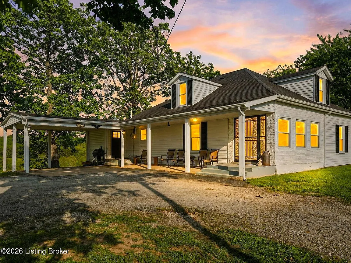 Country Farmhouse on 7.67 Acres with Pond and Barns